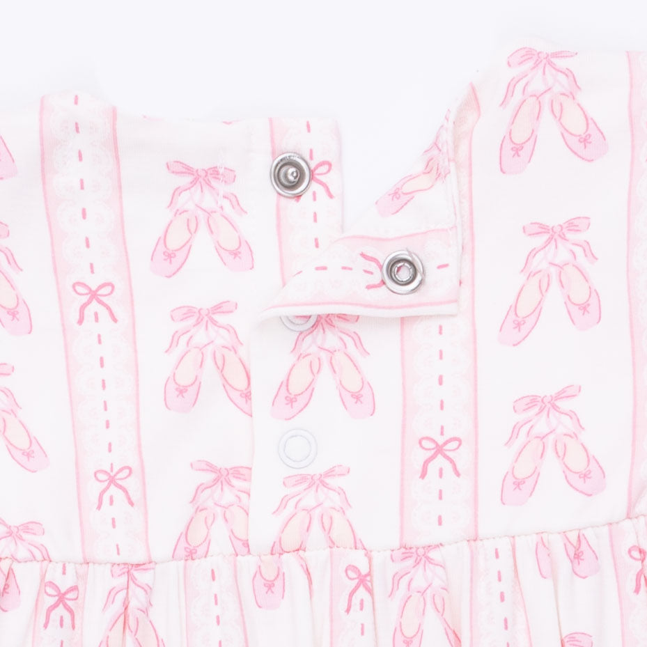 White fabric with pink ballet slipper pattern on a white background