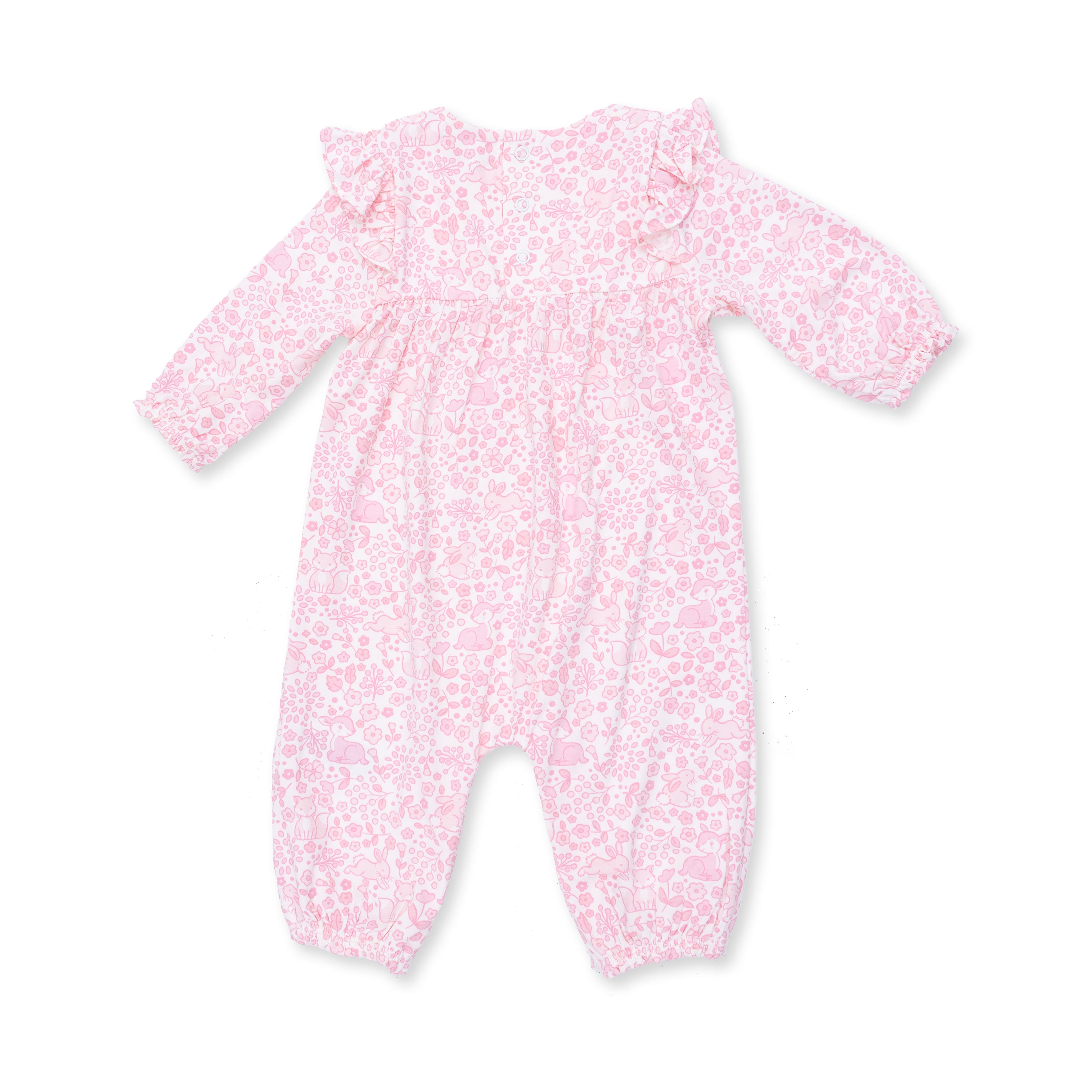 Pink baby onesie with woodland pattern on a white background