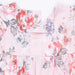 Floral patterned outfit with pink background