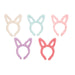Set of five pastel-colored bunny ear headbands on a white background