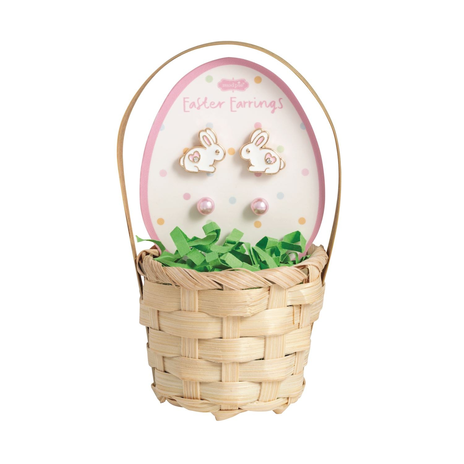 Easter-themed basket with bunny earrings and grass, on a white background