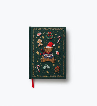 Dark green embroidered holiday journal featuring a teddy bear in a Santa hat with festive ornaments and a red ribbon bookmark by Rifle Paper Co.