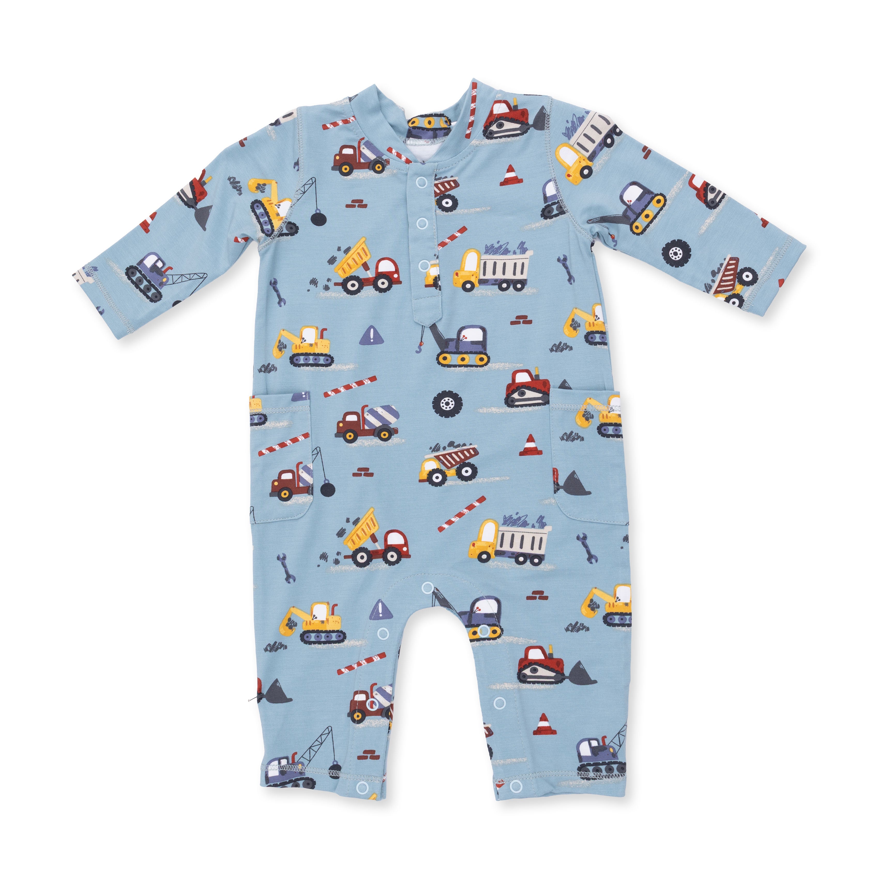 Baby onesie with construction vehicle pattern on a white background