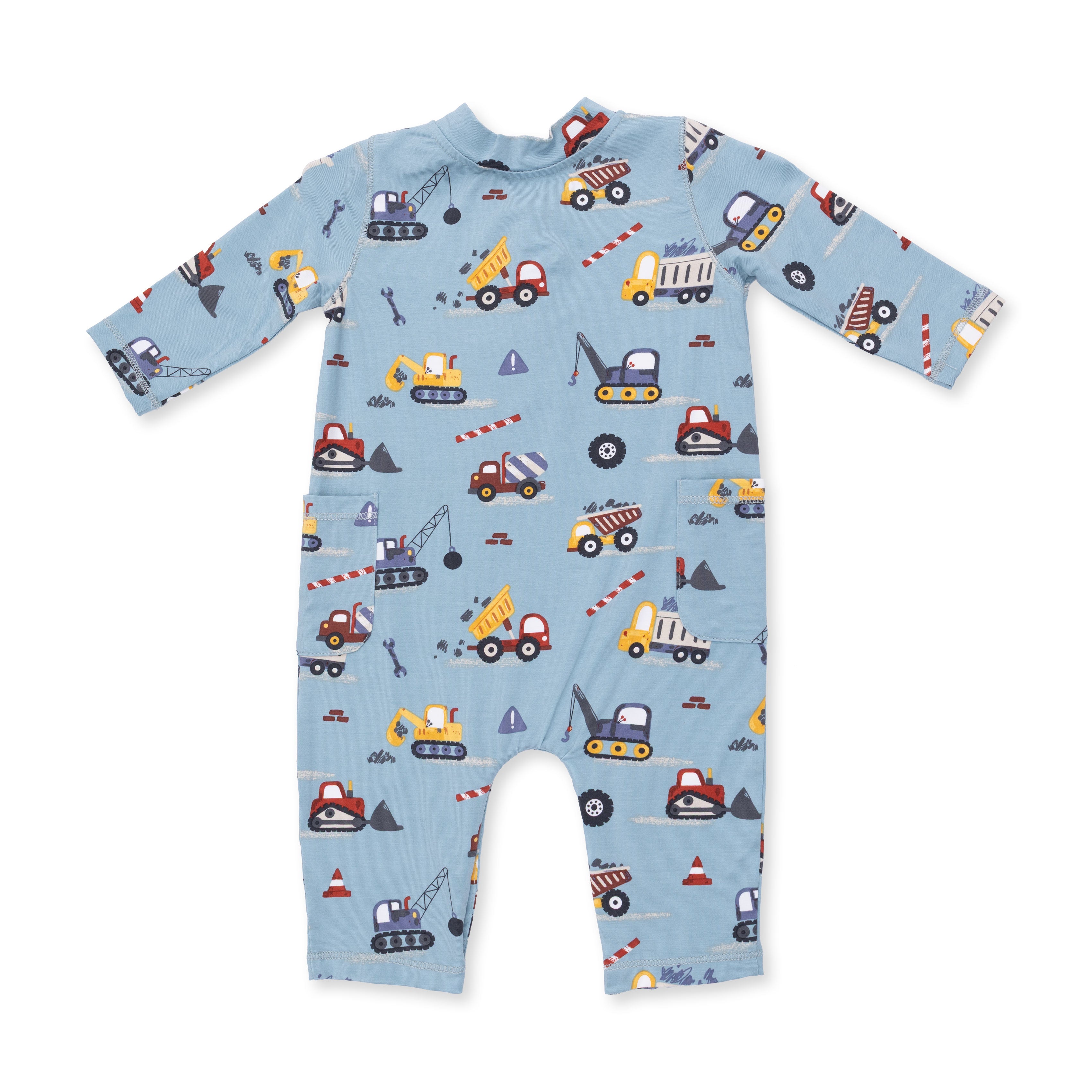 Children's onesie with construction vehicle pattern on a light blue background