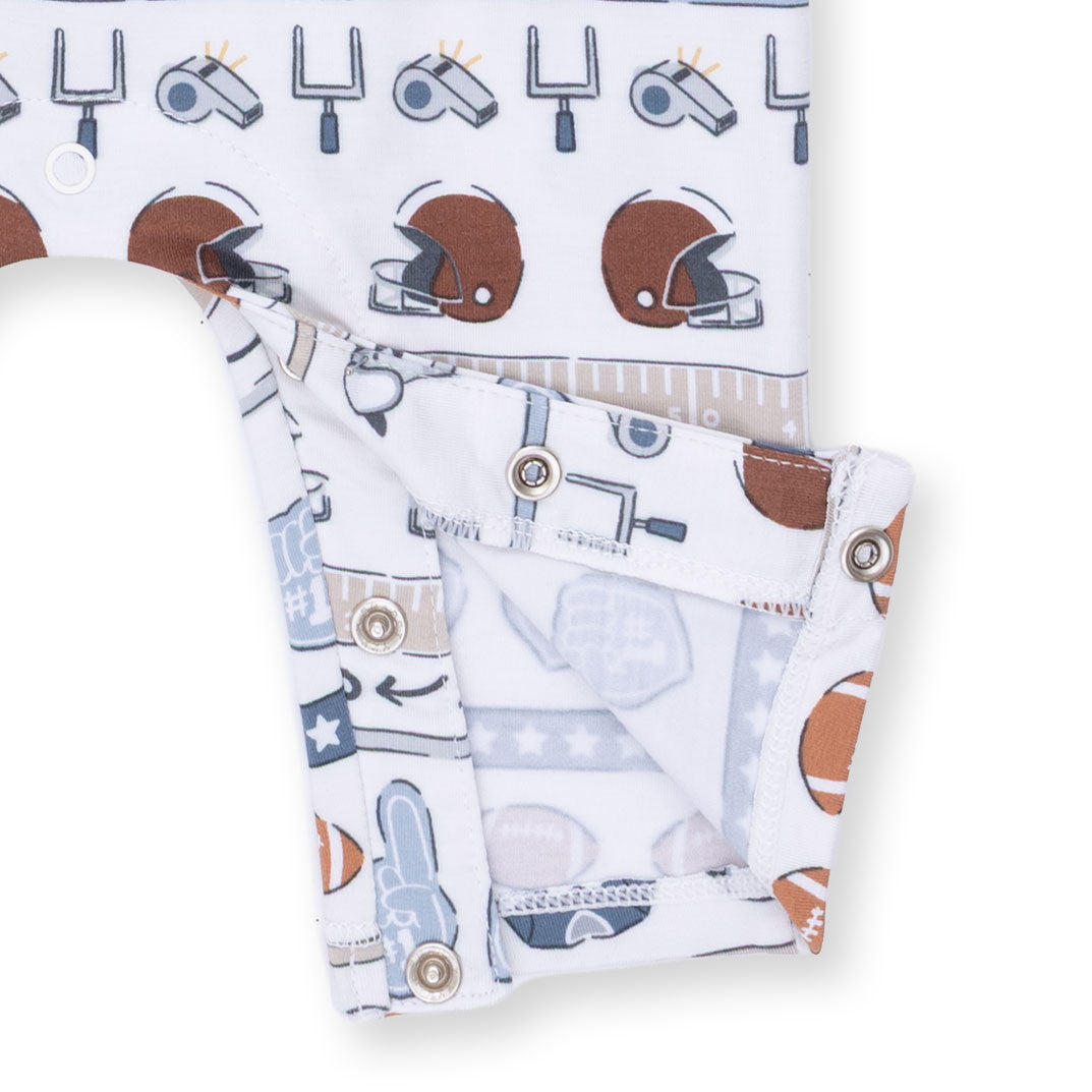 Romper with football-themed pattern on a white background