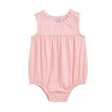 Pink baby romper with ruffled shoulders on a white background