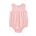 Pink baby romper with ruffled shoulders on a white background