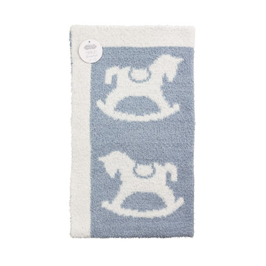 Blue and white rug with rocking horse design on a white background