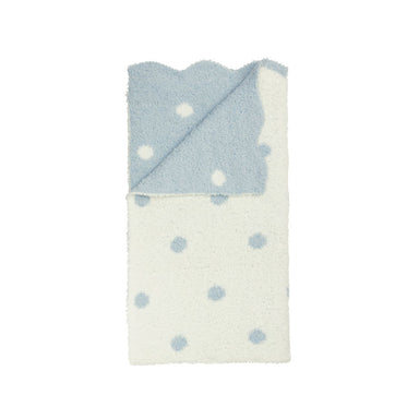 Baby blanket with blue and white polka dots on a white background