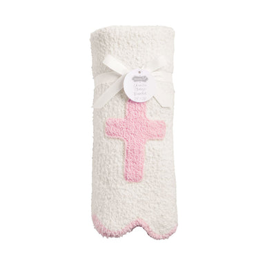 Knitted blanket with pink cross design on a white background