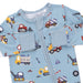 Children's blue outfit with construction vehicle pattern on a white background