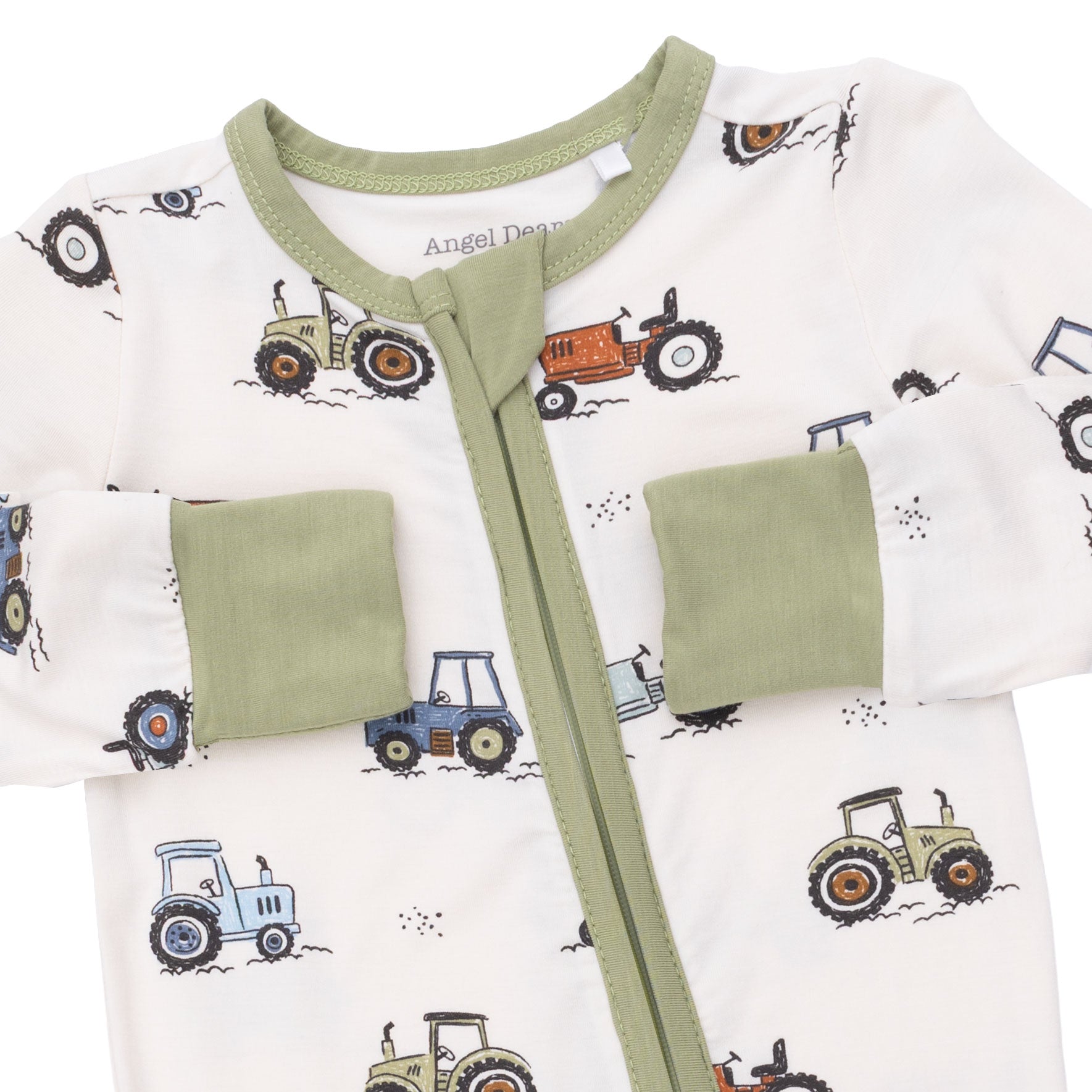 Baby outfit with green trim and tractor patterns on a white background