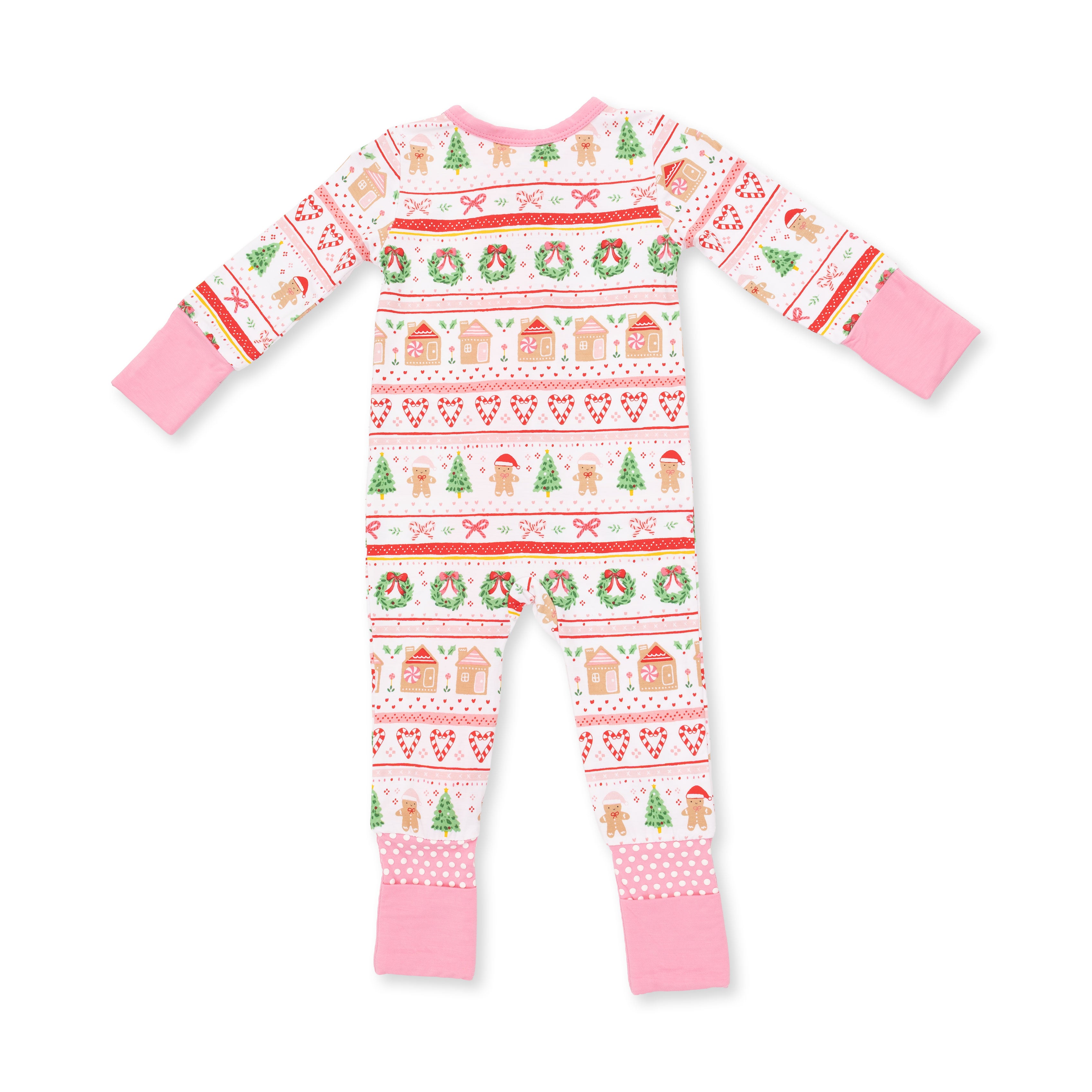 A baby long-sleeve footed pajama romper with a festive Christmas fair isle pattern on a white background, featuring pink cuffs and hem, and red, green, and orange holiday motifs.