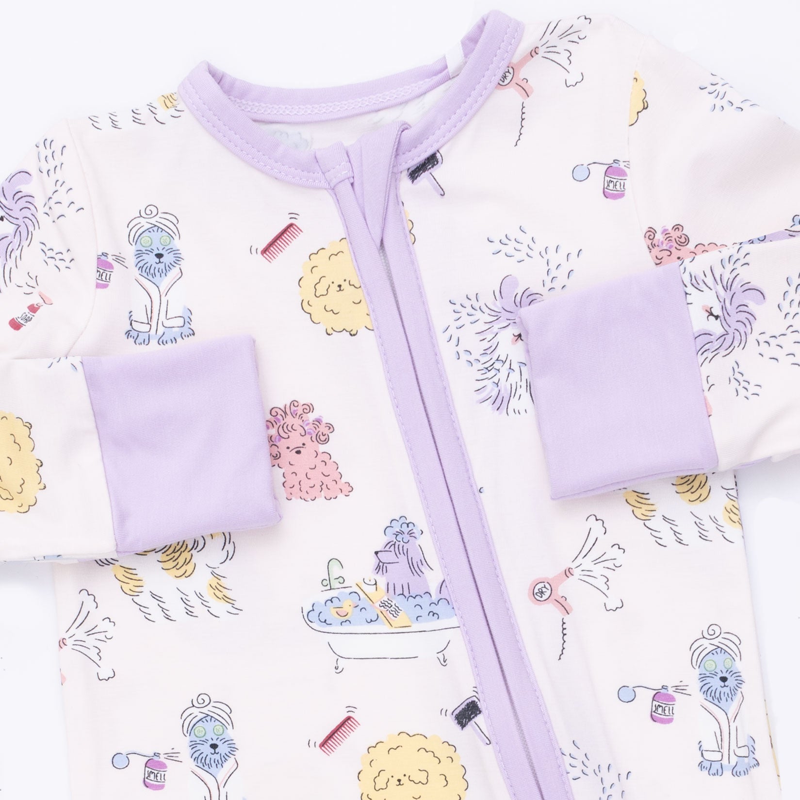 Baby outfit with purple zipper and cartoon designs on a white background