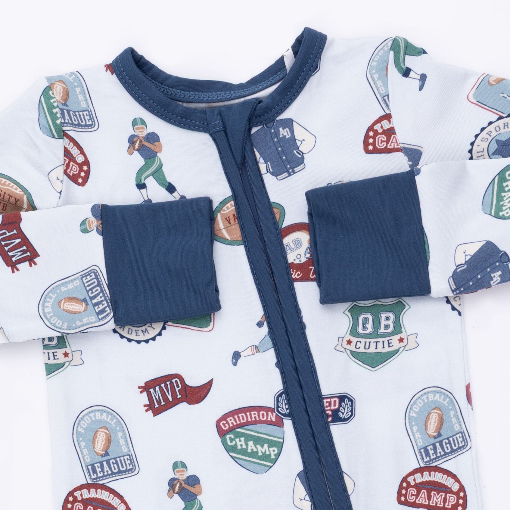 Children's outfit with sports-themed print and navy accents