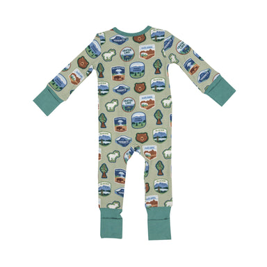 Green romper with national park patches