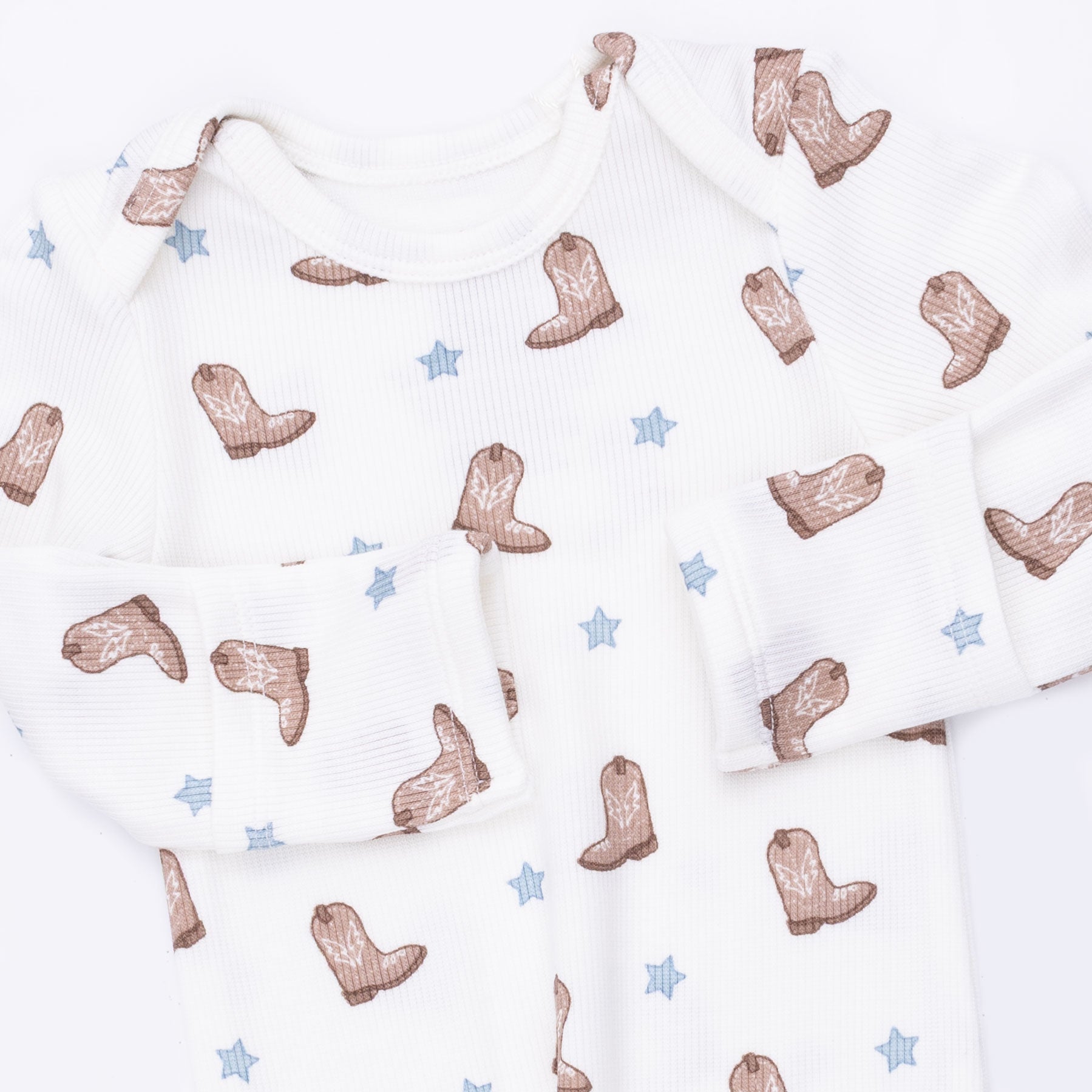 Baby fabric with cowboy boot and star pattern on a white background