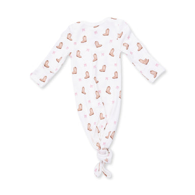 Baby onesie with boot pattern on a white background