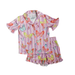 Children's pajama set with butterfly pattern on a purple and pink striped background