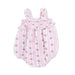 Pink floral baby romper on a white background