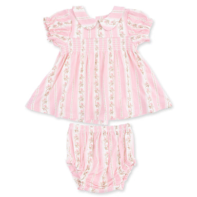 Pink baby dress with ruffled details and matching bloomers on a white background
