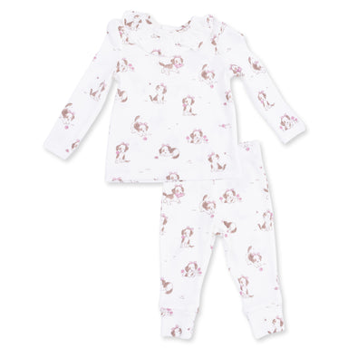 Children's ruffle top and pant setwith dog pattern on a white background