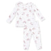 Children's ruffle top and pant setwith dog pattern on a white background