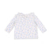 White long-sleeve shirt with blue floral pattern on a white background