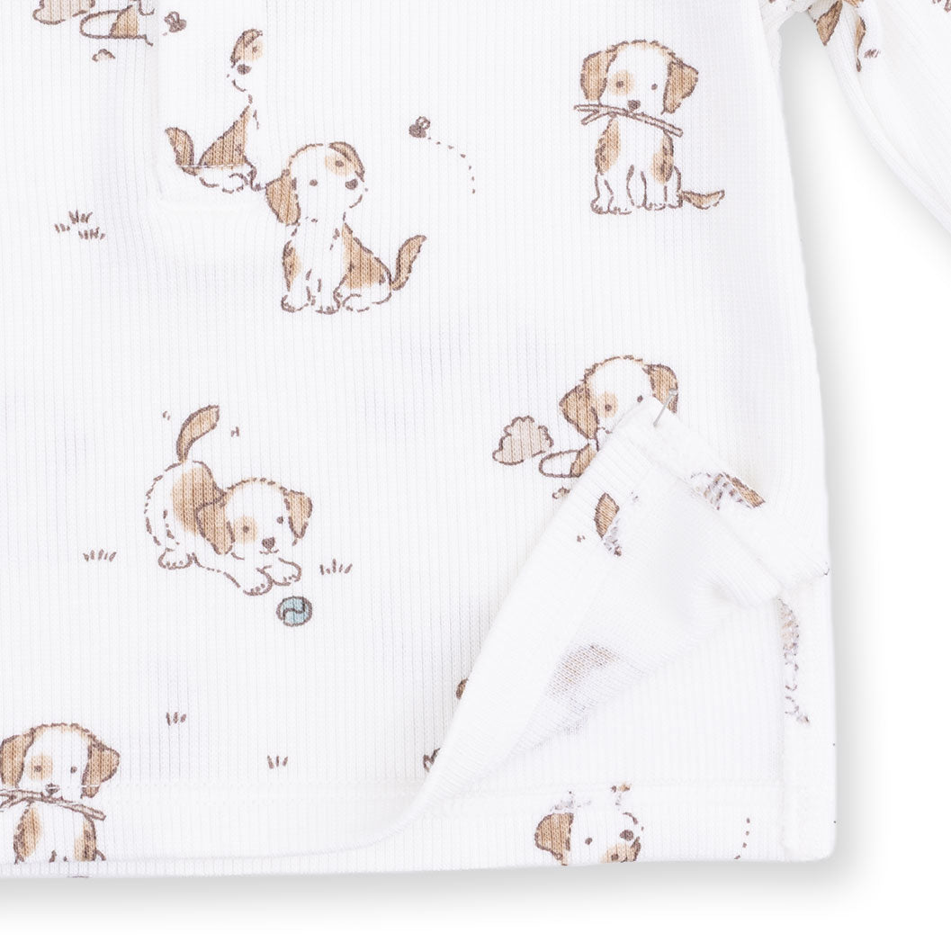 Fabric with brown puppies pattern on a white background
