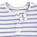 Close-up of a baby outfit with blue and white stripes and button details.