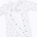 A baby long-sleeve romper in white with a light blue floral print, featuring ruffled trim along the neckline and front button closure.