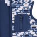 Close-up of a children's zippered fleece vest showing a navy blue zipper, a front zip pocket, and a geometric patterned fleece lining in navy, cream, and tan.