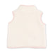 A sleeveless fleece vest in a warm off-white/cream color with light pink trim, shown from the back on a plain white background.
