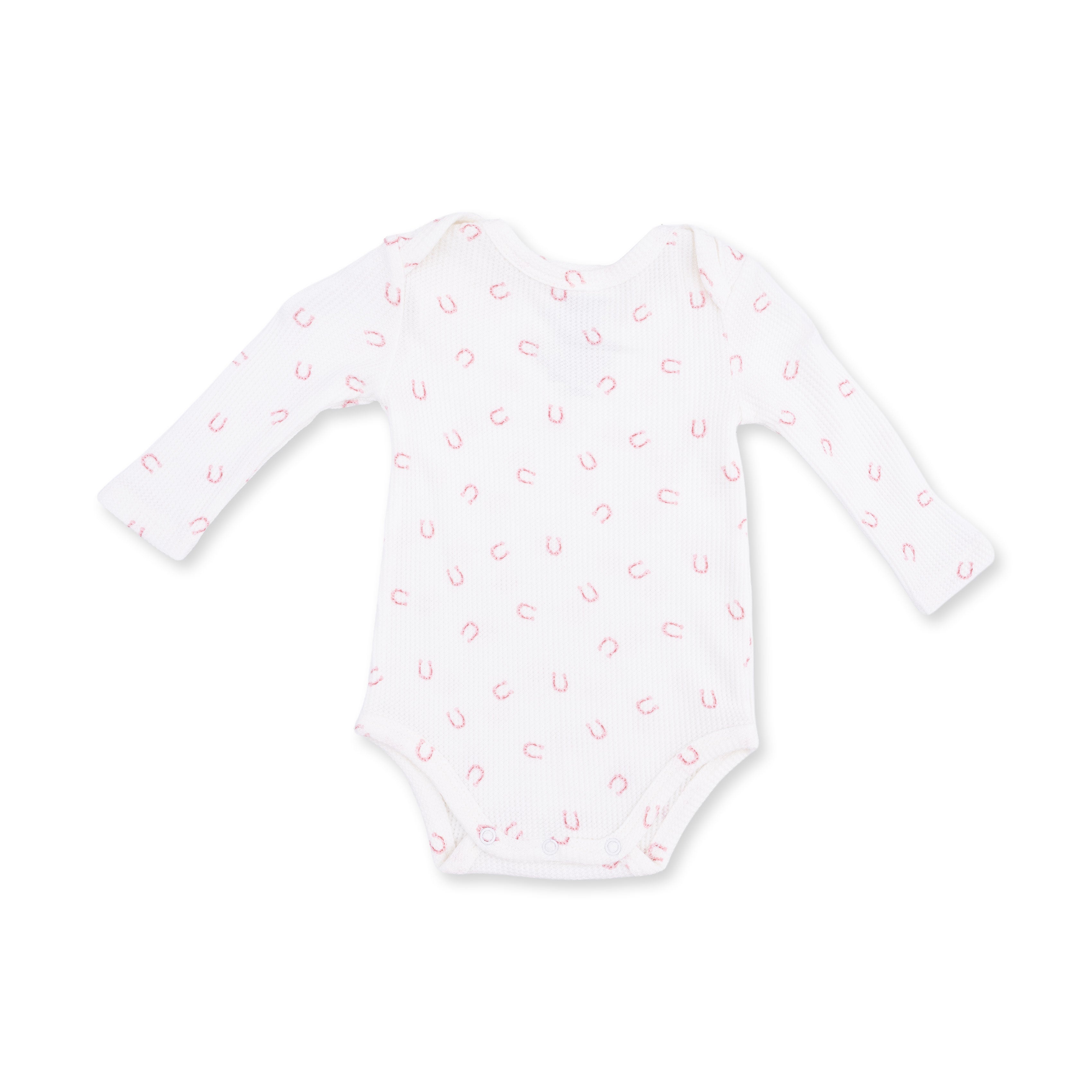 White baby onesie with pink horseshoe pattern on a white background