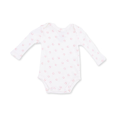 White baby onesie with pink horseshoe pattern on a white background