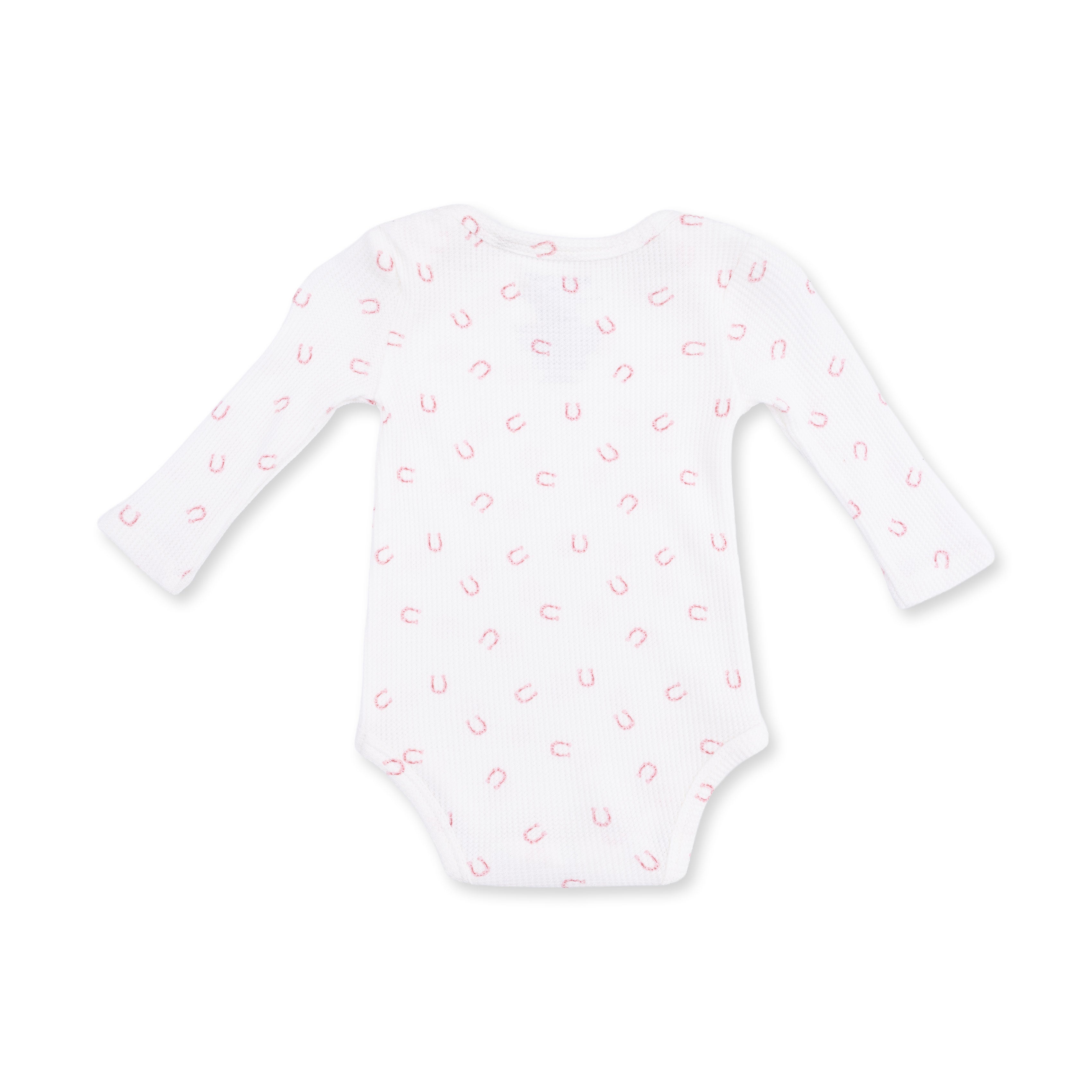White baby onesie with pink horseshoe pattern on a white background