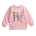 Pink sweatshirt with sequin nutcracker design on a white background