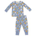 A two-piece children's pajama set featuring a long-sleeve top and matching pants in a dusty blue color, both printed with a festive Halloween pattern of smiling pumpkins, ghosts, moons, and stars. The pajamas are displayed flat against a solid white background.