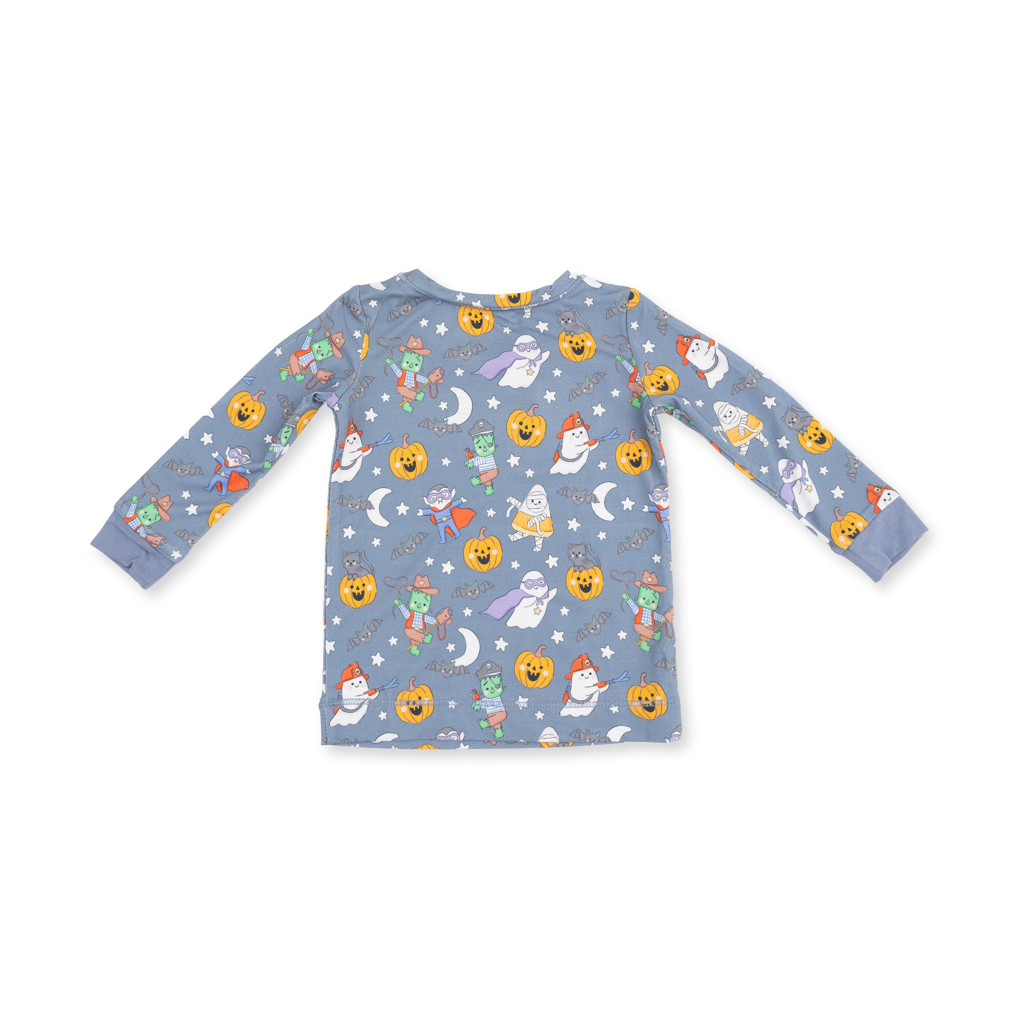 A long-sleeve baby t-shirt in dusty blue with an all-over Halloween print featuring pumpkins, ghosts, moons, and stars, shown flat on a white background.