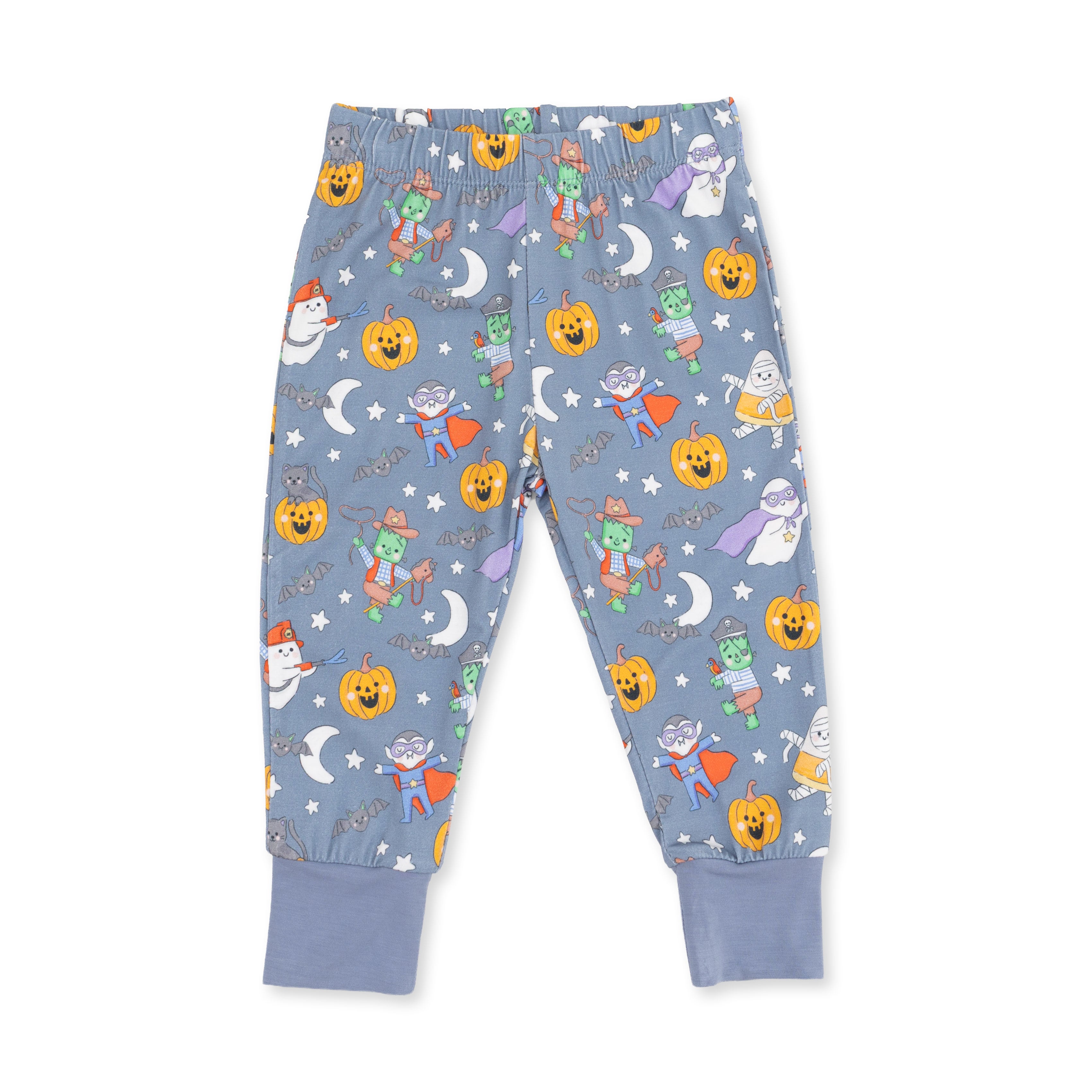 A pair of children's blue pajama pants with an all-over Halloween print featuring pumpkins, ghosts, wizards, and stars, shown flat on a white background.