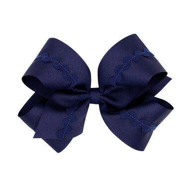 Navy grosgrain hair bow with ric-rac trim