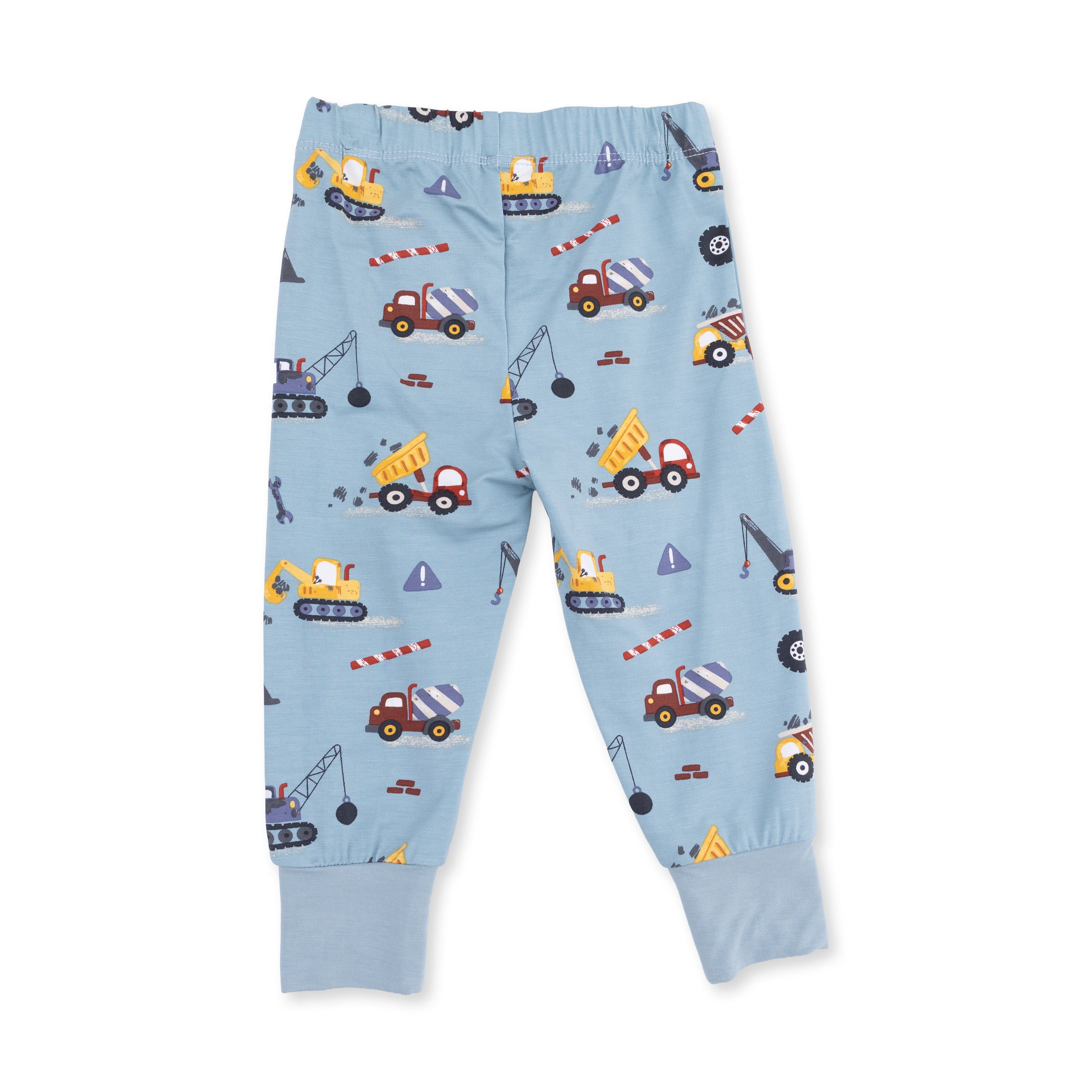 Light blue children's pants with construction vehicle pattern on a white background