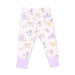 A pair of children's pajama pants in a very pale pink, featuring an allover whimsical print of cartoon dogs at the spa in pastel purple, yellow, and blue. The pants have solid light purple ribbed ankle cuffs.