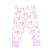 A pair of children's pajama pants in a very pale pink, featuring an allover cartoon print of dogs at the spa, finished with solid light purple cuffs.