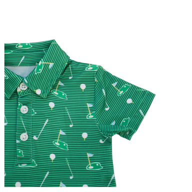 Green children's romper with golf pattern on a white background