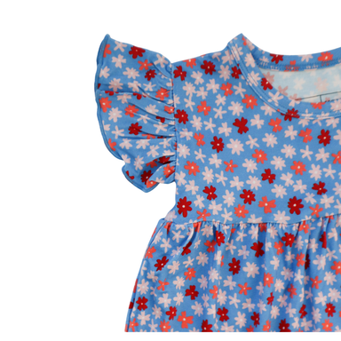Children's gown with ruffled sleeve and red and white floral pattern on a blue background