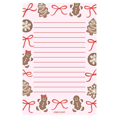 Pink Christmas notepad with lined writing space and gingerbread cookies snowflakes and red bows from Pippi Post