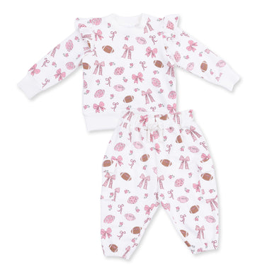 Baby two piece set with pink and brown football pattern on a white background