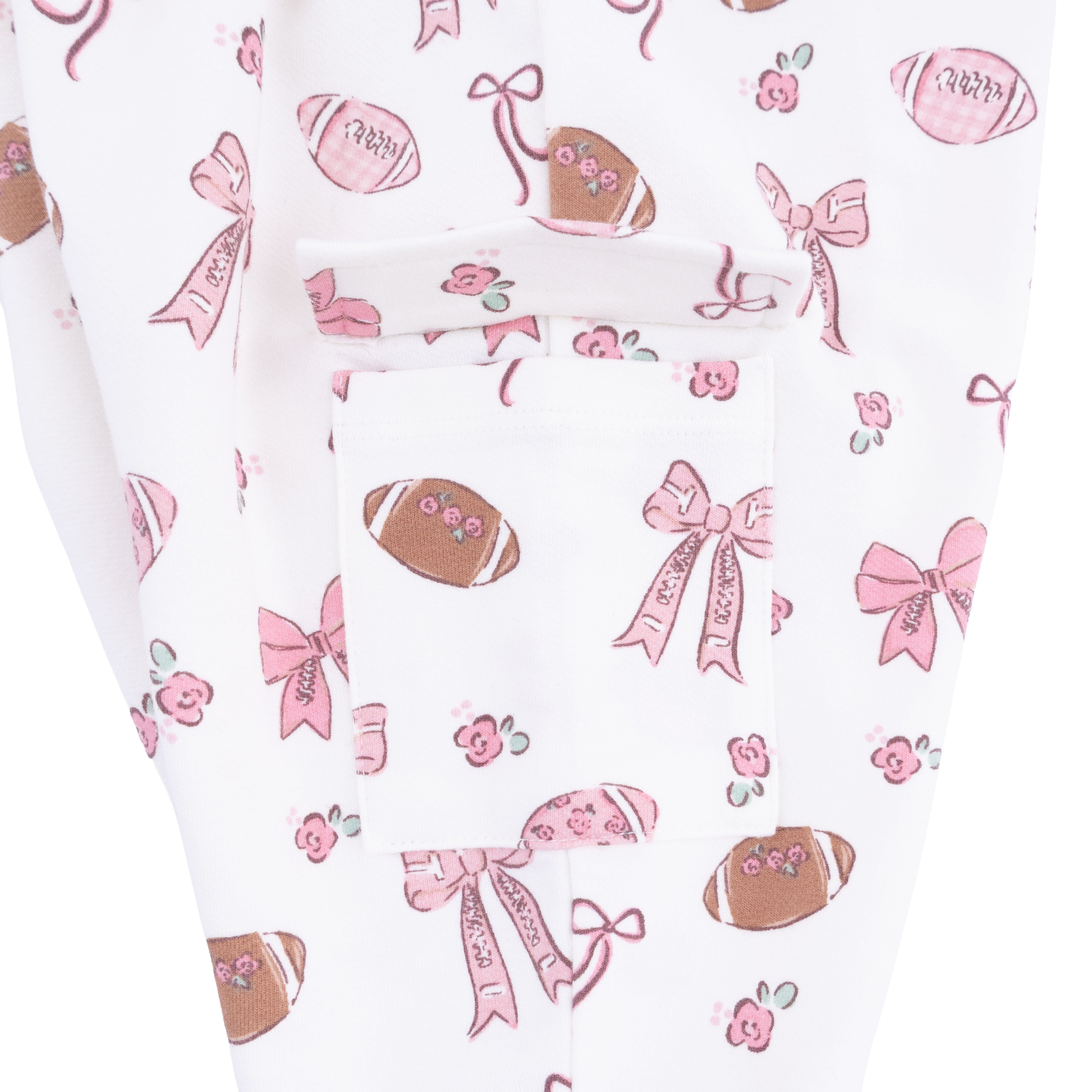 Patterned fabric with footballs, bows, and flowers on a white background