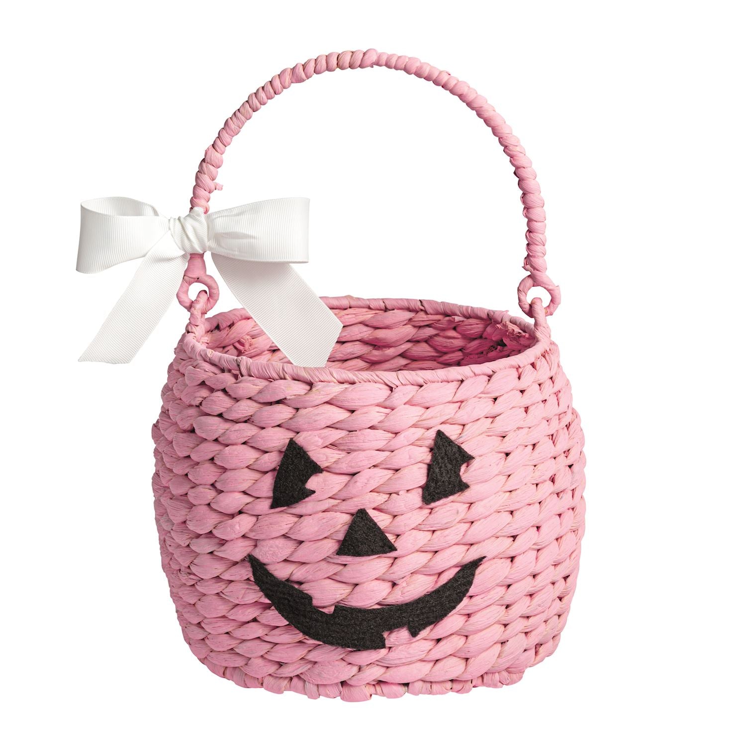 Pink woven Halloween basket with a white bow on a white background